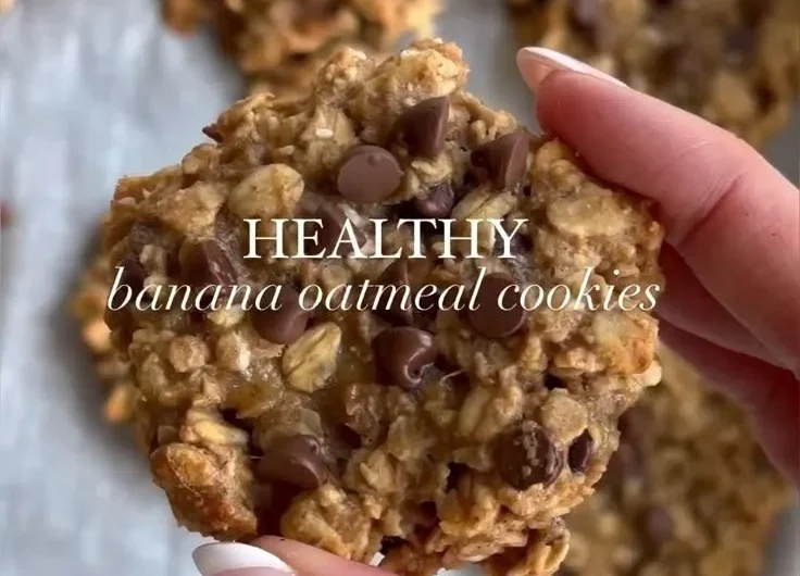 Delicious chocolate chip banana oatmeal cookies on a wooden table.