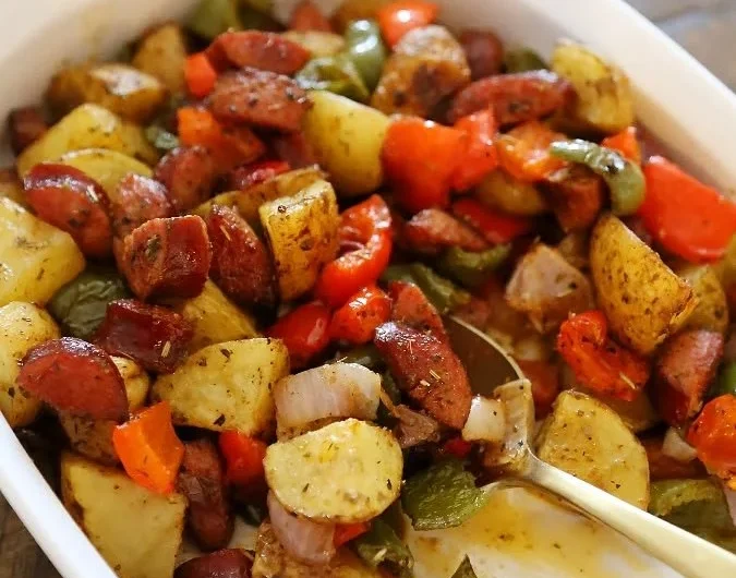 One-pan roasted sausage with colorful peppers and potatoes ready to serve.