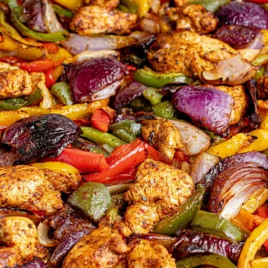 Delicious sheet pan chicken fajitas with colorful peppers and onions ready to serve.