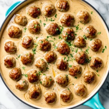 Delicious homemade IKEA meatballs served with creamy gravy and lingonberry sauce