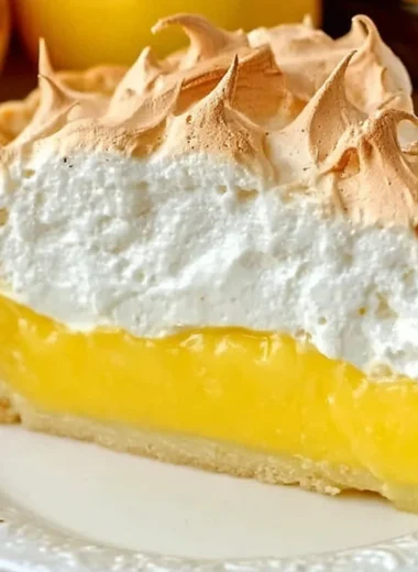 Homemade lemon meringue pie with fluffy meringue topping and lemon filling