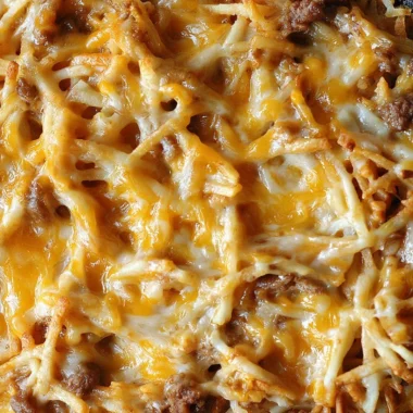 Taco Hashbrown Casserole cooked in a crock pot, served in a bowl