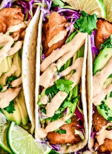Plated cozy Baja Fish Tacos with fresh ingredients and toppings