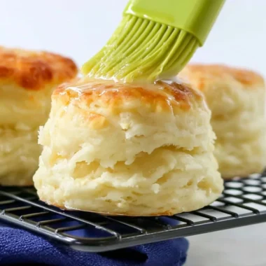 Delicious homemade self-rising flour biscuits on a wooden table