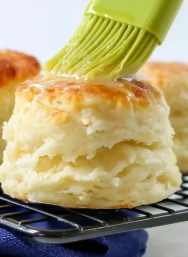 Delicious homemade self-rising flour biscuits on a wooden table