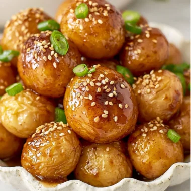 Cozy Korean Braised Potatoes served in a bowl, garnished with green onions.