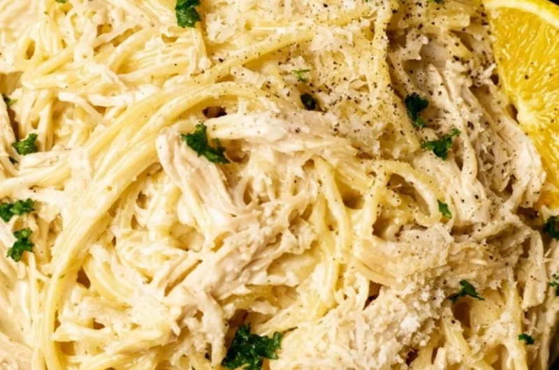 Creamy lemon chicken pasta served in a bowl with fresh herbs