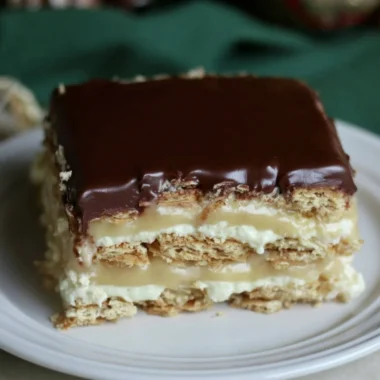 Delicious Eclair Icebox Cake with layers of cream and chocolate