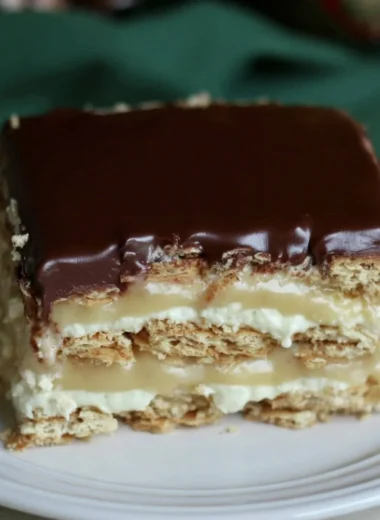 Delicious Eclair Icebox Cake with layers of cream and chocolate