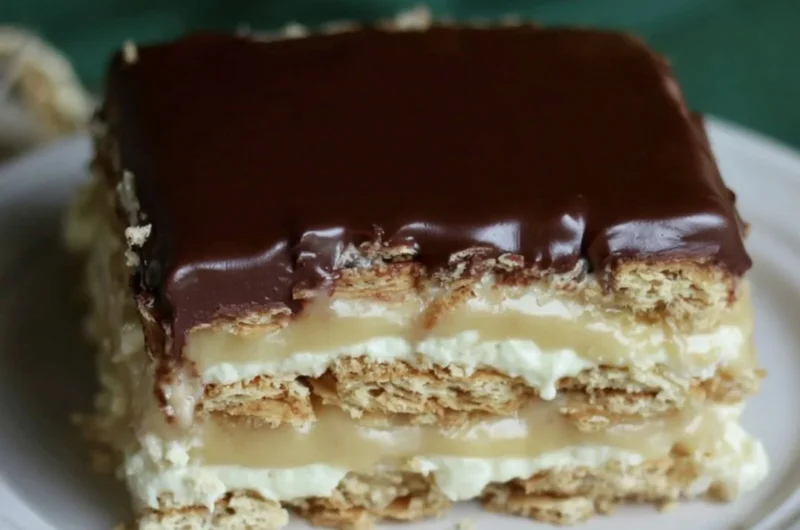 Delicious Eclair Icebox Cake with layers of cream and chocolate