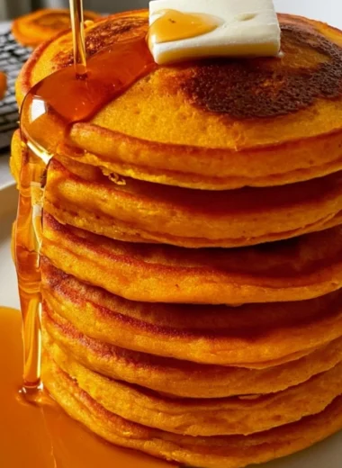 Cozy pumpkin cottage cheese pancakes stacked on a plate