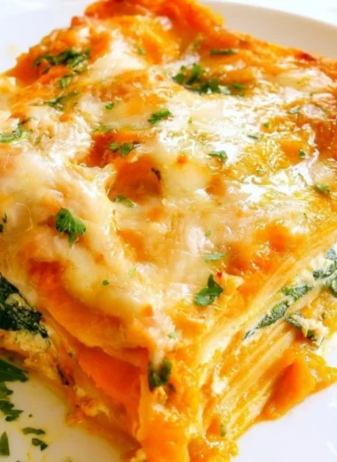 Delicious pumpkin spinach lasagna layered with vegetables and cheesy goodness