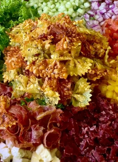 Bowl of Crispy Italian Pasta Salad with fresh vegetables and herbs