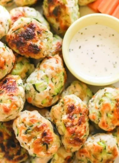 Plate of kid-friendly veggie chicken nuggets with dipping sauce.